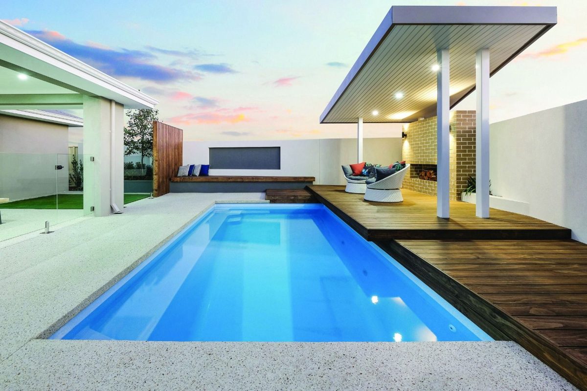 Modern pool with clear blue water at dusk