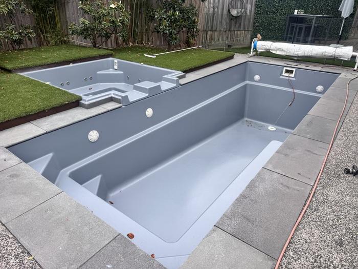 Concrete pool with steps in grey, before filling