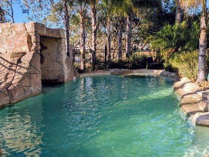 Lagoon-style pool with rock waterfall